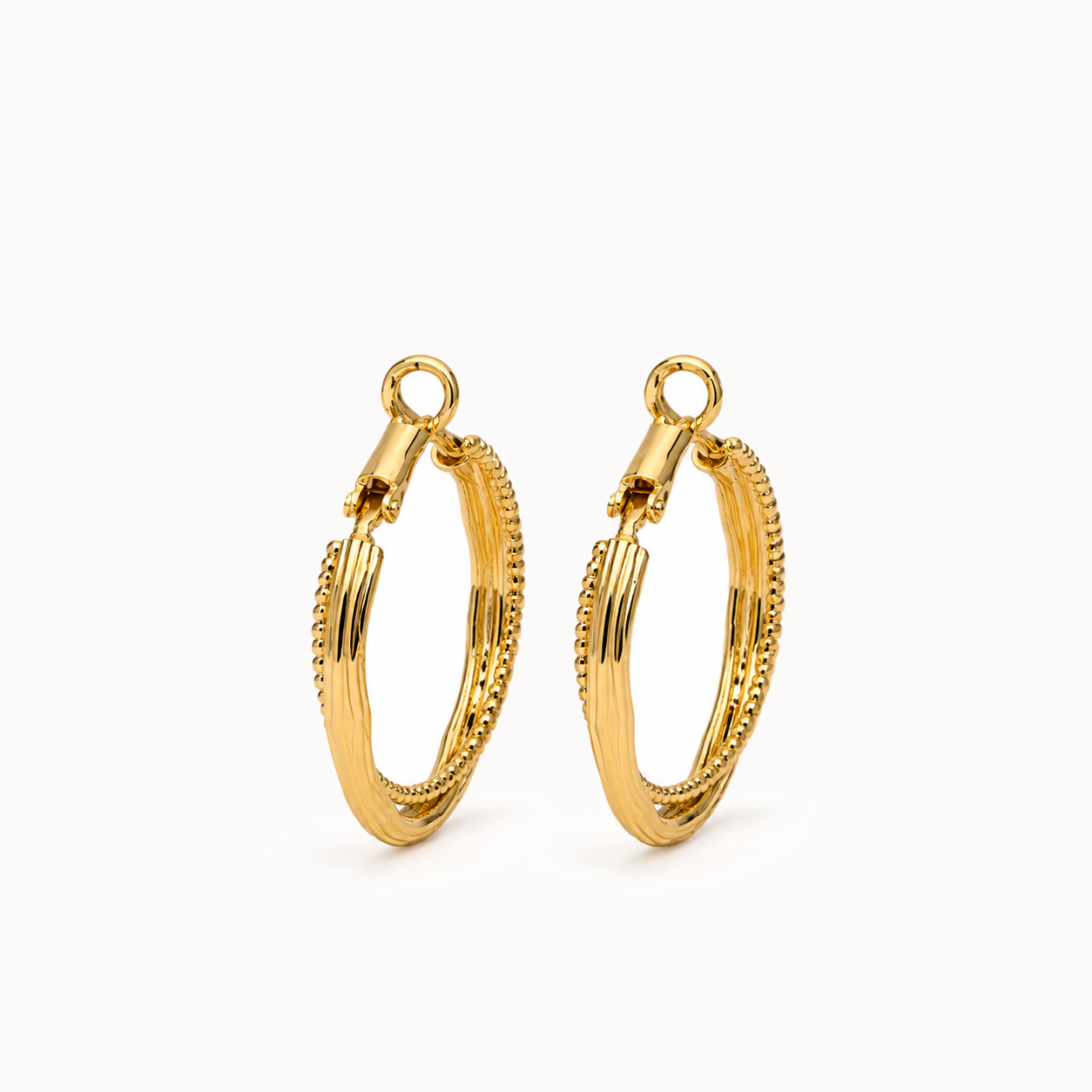 Gold-Tone Textured Oval Hoop Earrings | Pimosfer - image 1